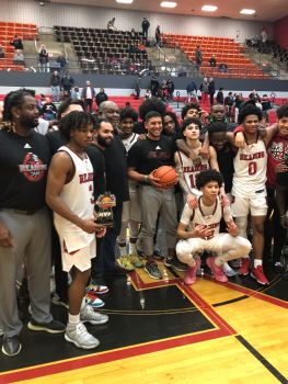Reading High boys basketball coach Rick Perez accepts the game ball with his team after the Red Knights defeat Cardinal O'Hara to claim Perez' school record-setting 252nd career win. (ANDREW HELLER - READING EAGLE) 阅读高男孩篮球教练里克·佩雷斯接受游戏球后与他的团队“红魔骑士打败红衣主教奥哈拉声称佩雷斯的学校生涯创纪录的252胜。(安德鲁·海勒-阅读鹰)